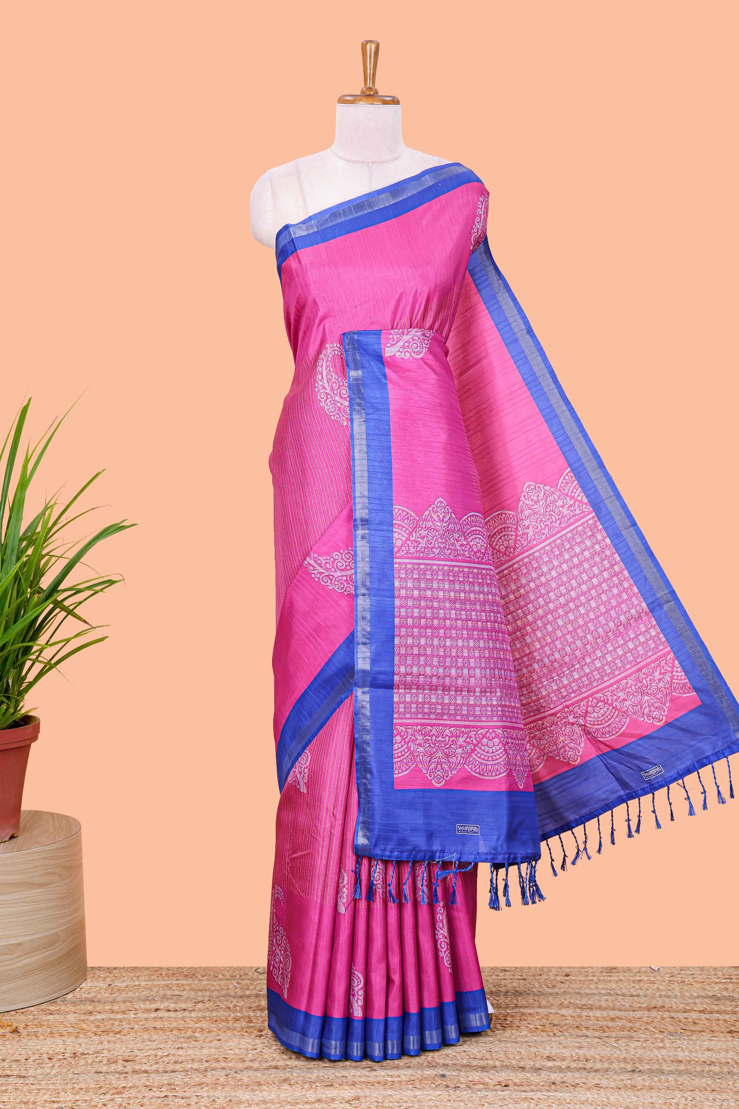 Pink striped floral butta art tussar saree with contrast zari border and matching pallu