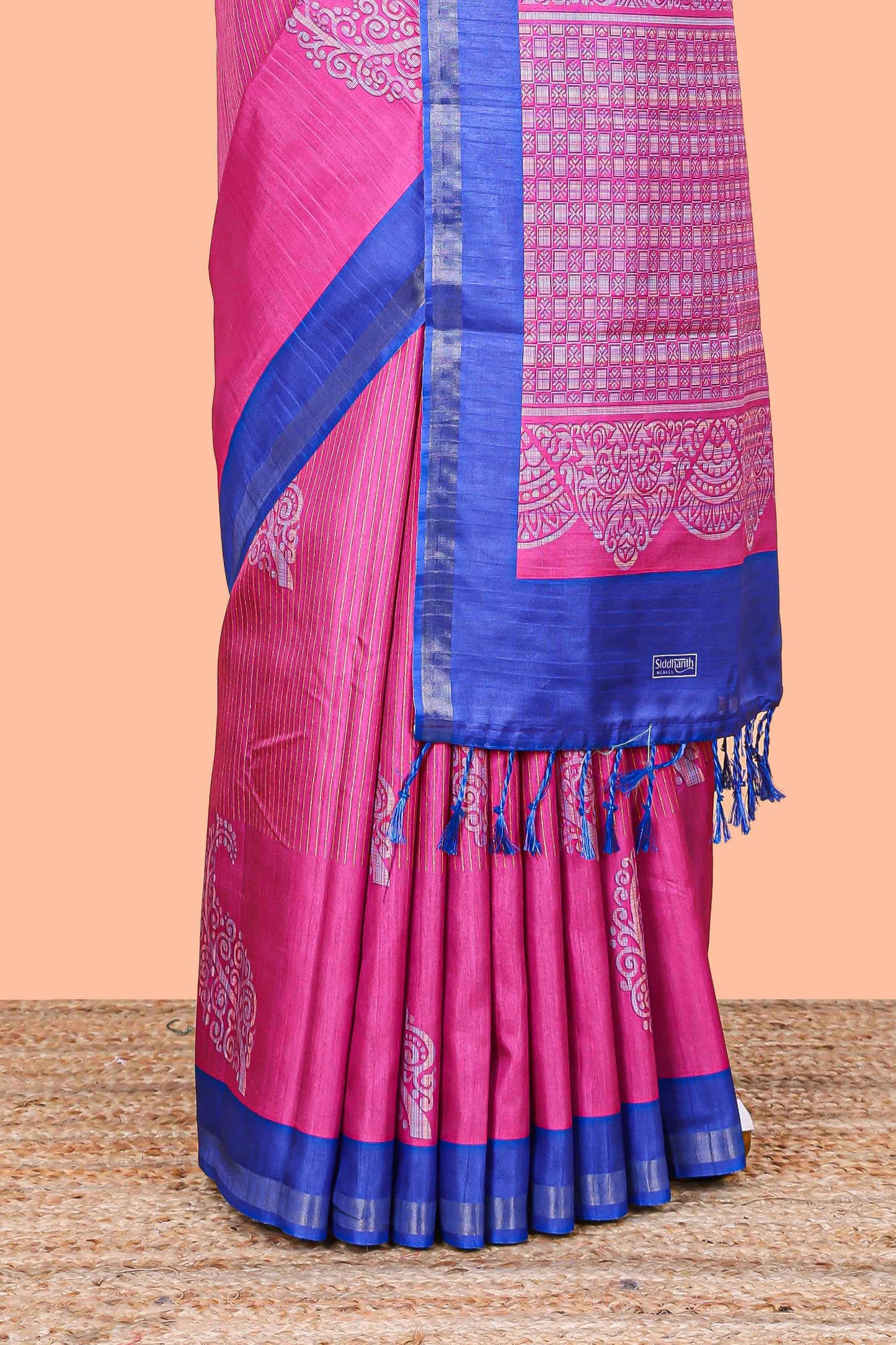 Pink striped floral butta art tussar saree with contrast zari border and matching pallu