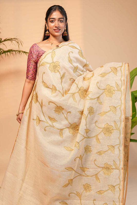 Cream floral design linen cotton saree with self zari border and matching printed blouse
