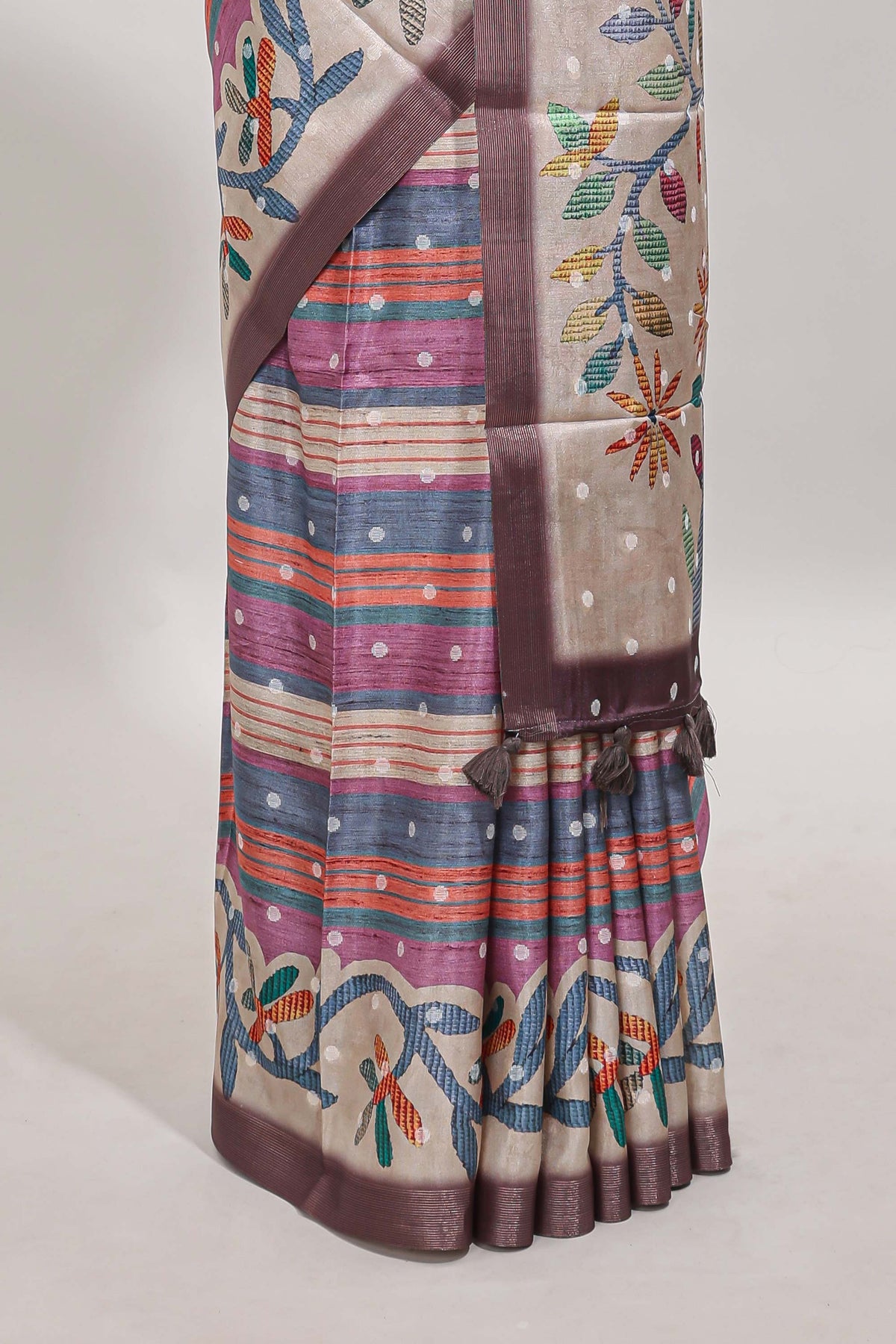 Multicolor Tussar Saree checkered body artistic floral prints and contrasting border with tassel along with blouse piece