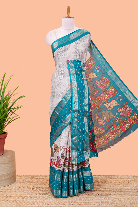 White Kalamkari style floral and crane birds print marsh georgette saree with turquoise green zari border and printed pallu