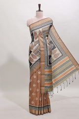 Elegant Tussar Saree with an earthy brown body ethnic prints intricate borders and tassel finished pallu along with contrast blouse