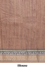 Elegant Tussar Saree with an earthy brown body ethnic prints intricate borders and tassel finished pallu along with contrast blouse