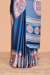 Blue color satin ajrakh modal printed saree with plain border and kalamkari print pallu