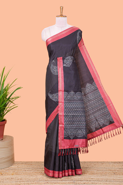 Black striped floral butta art tussar saree with contrast zari border and matching pallu