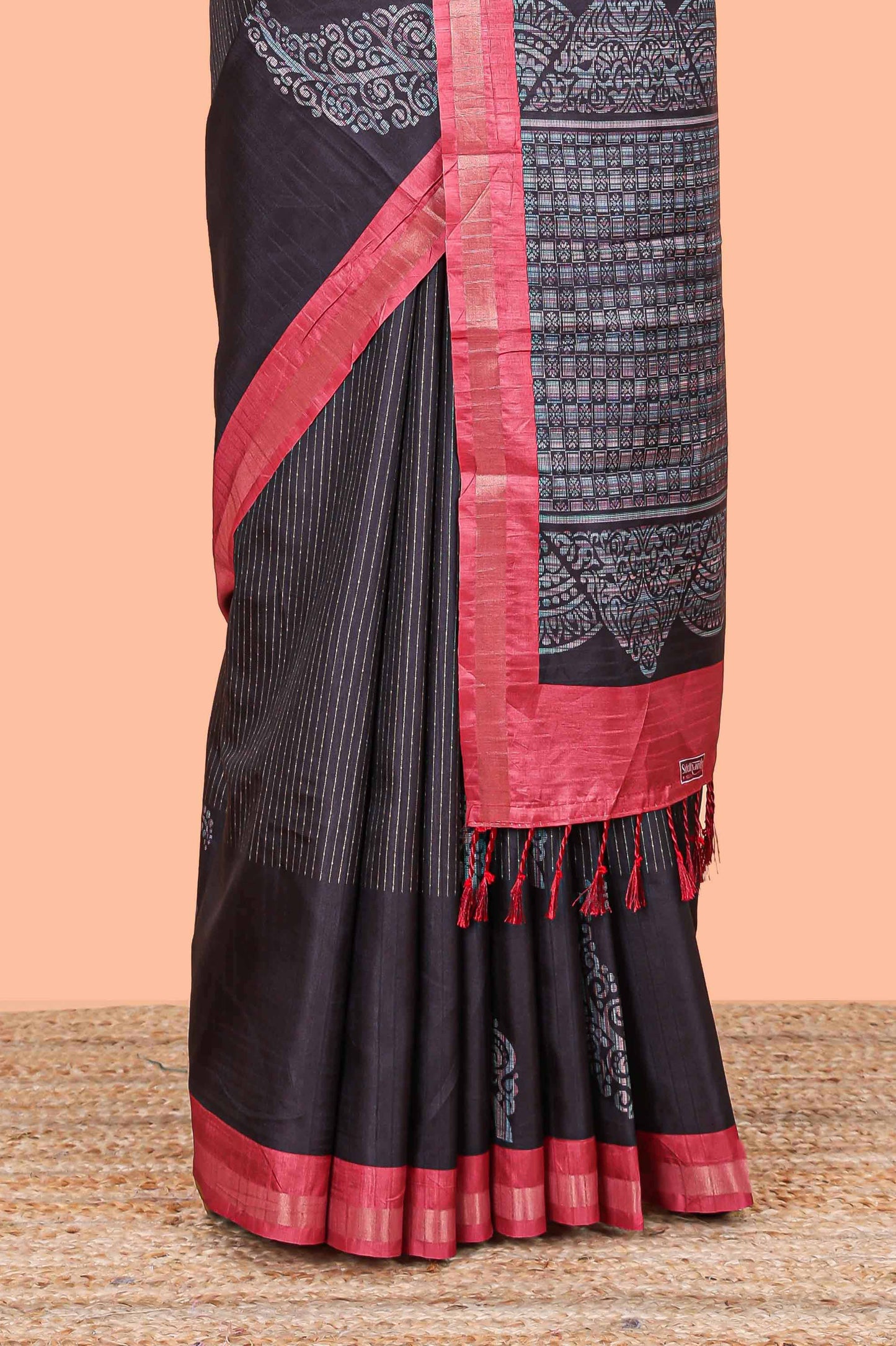 Black striped floral butta art tussar saree with contrast zari border and matching pallu