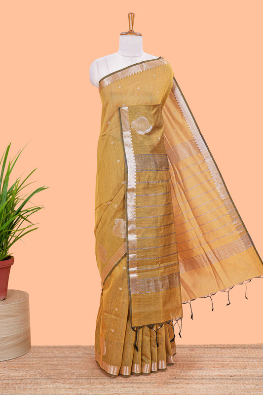 Mustard mushru silk saree with zari butta, self zari border and striped pallu