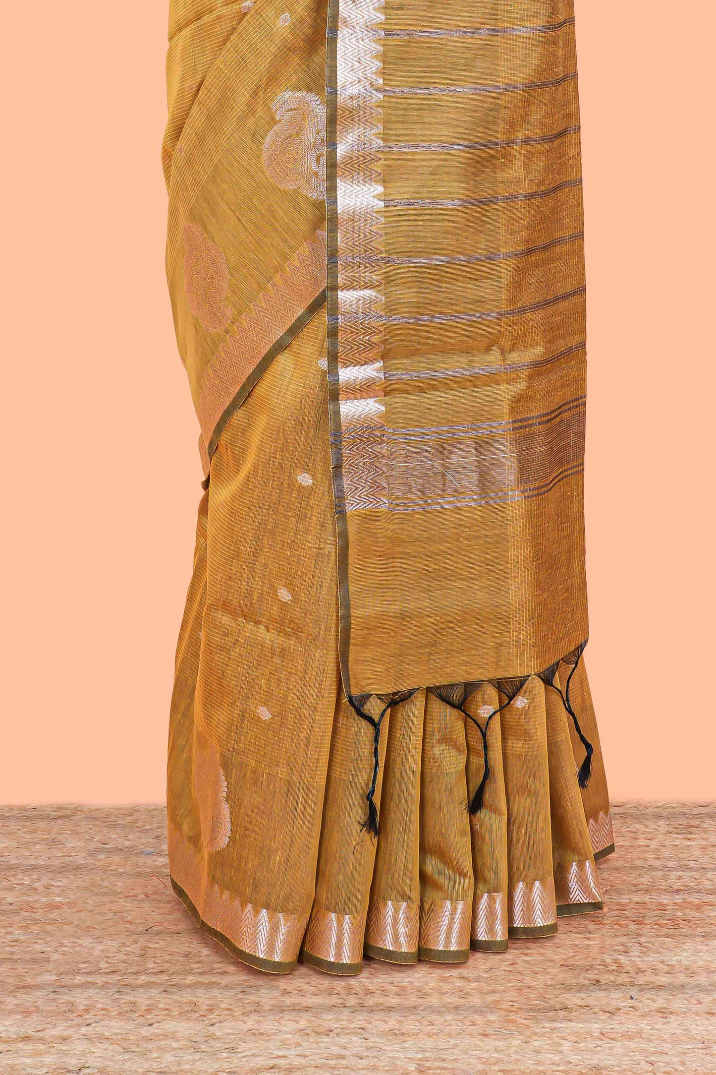 Mustard mushru silk saree with zari butta, self zari border and striped pallu