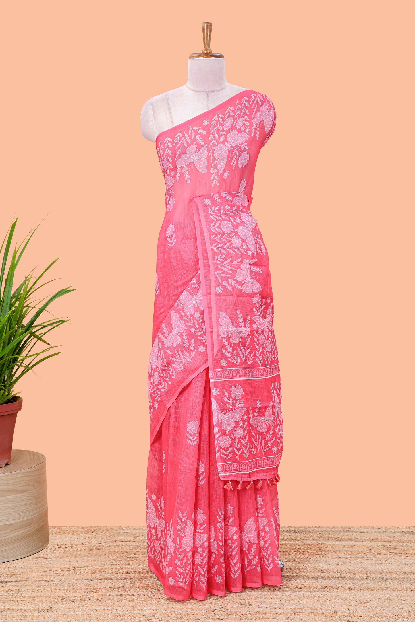 Pink linen cotton saree with floral buttas and butterfly motifs border, Printed self pallu and blouse