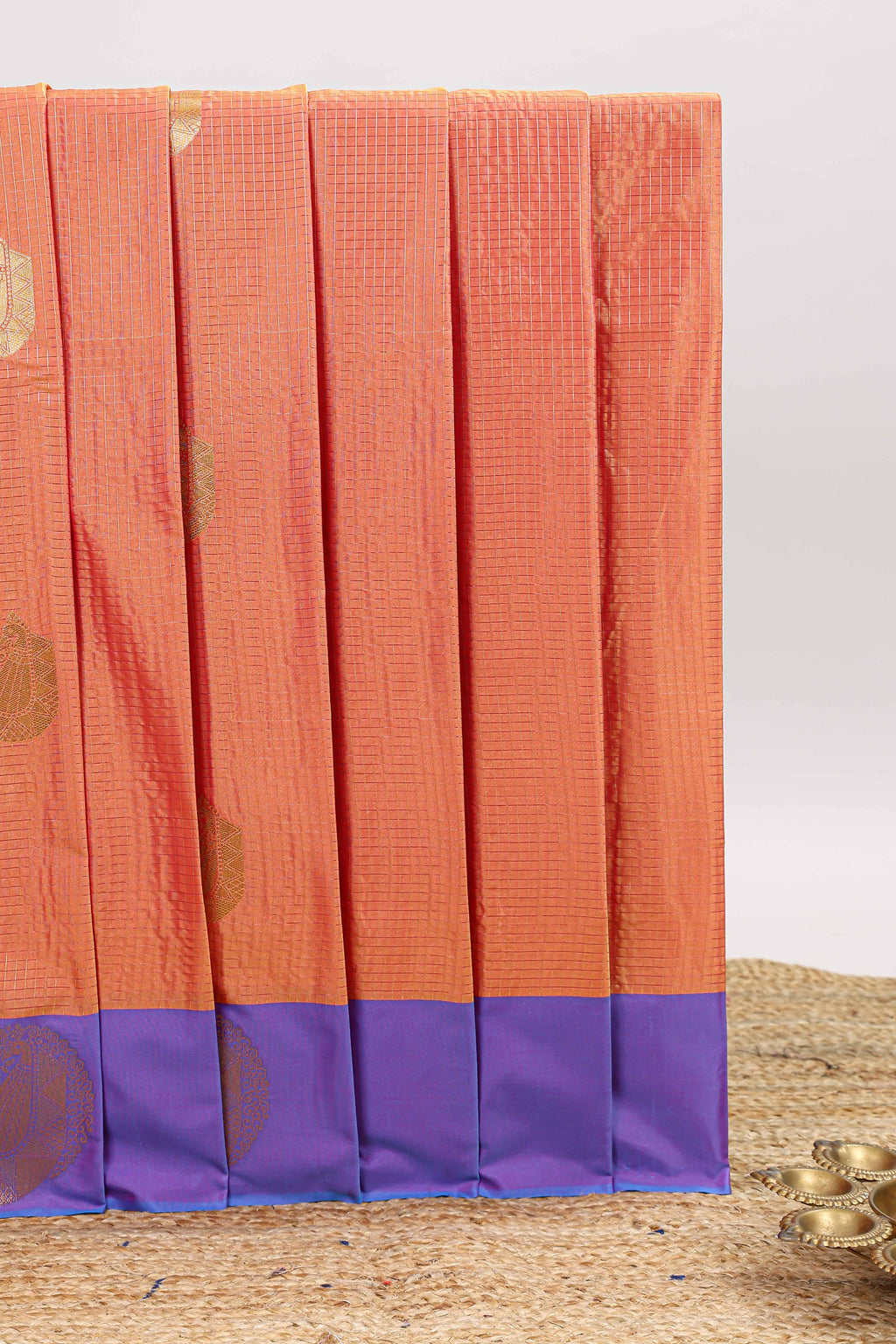 Orange checked zari motifs design art silk saree with contrast border and blouse