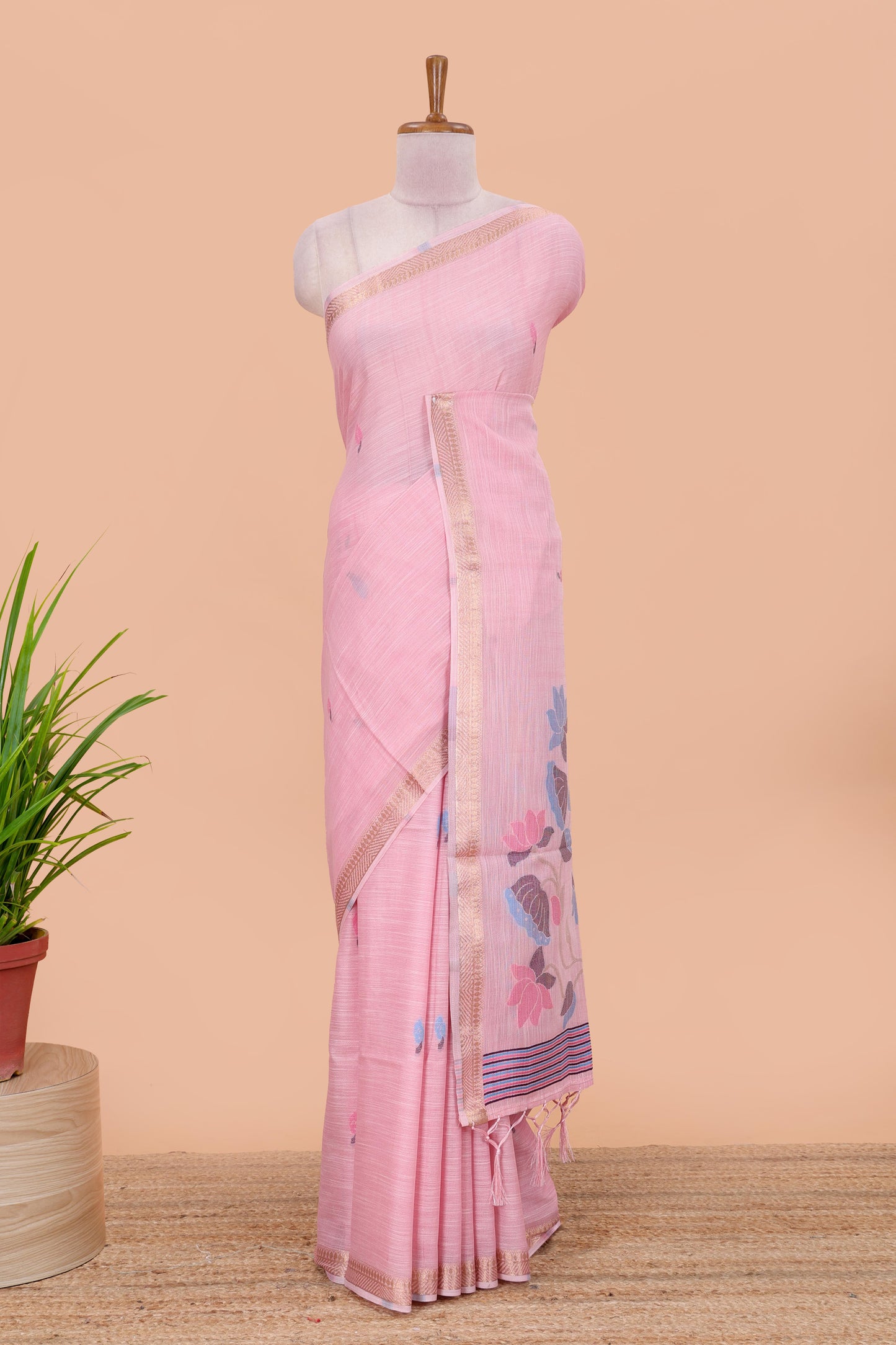 Pink linen cotton saree with buttas and floral design pallu, zari border