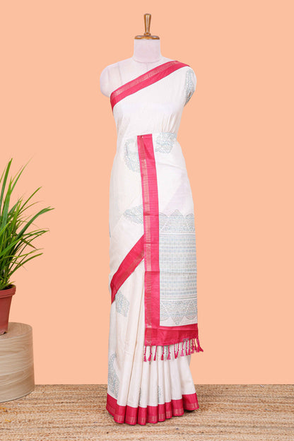 White striped floral butta art tussar saree with contrast zari border and matching pallu