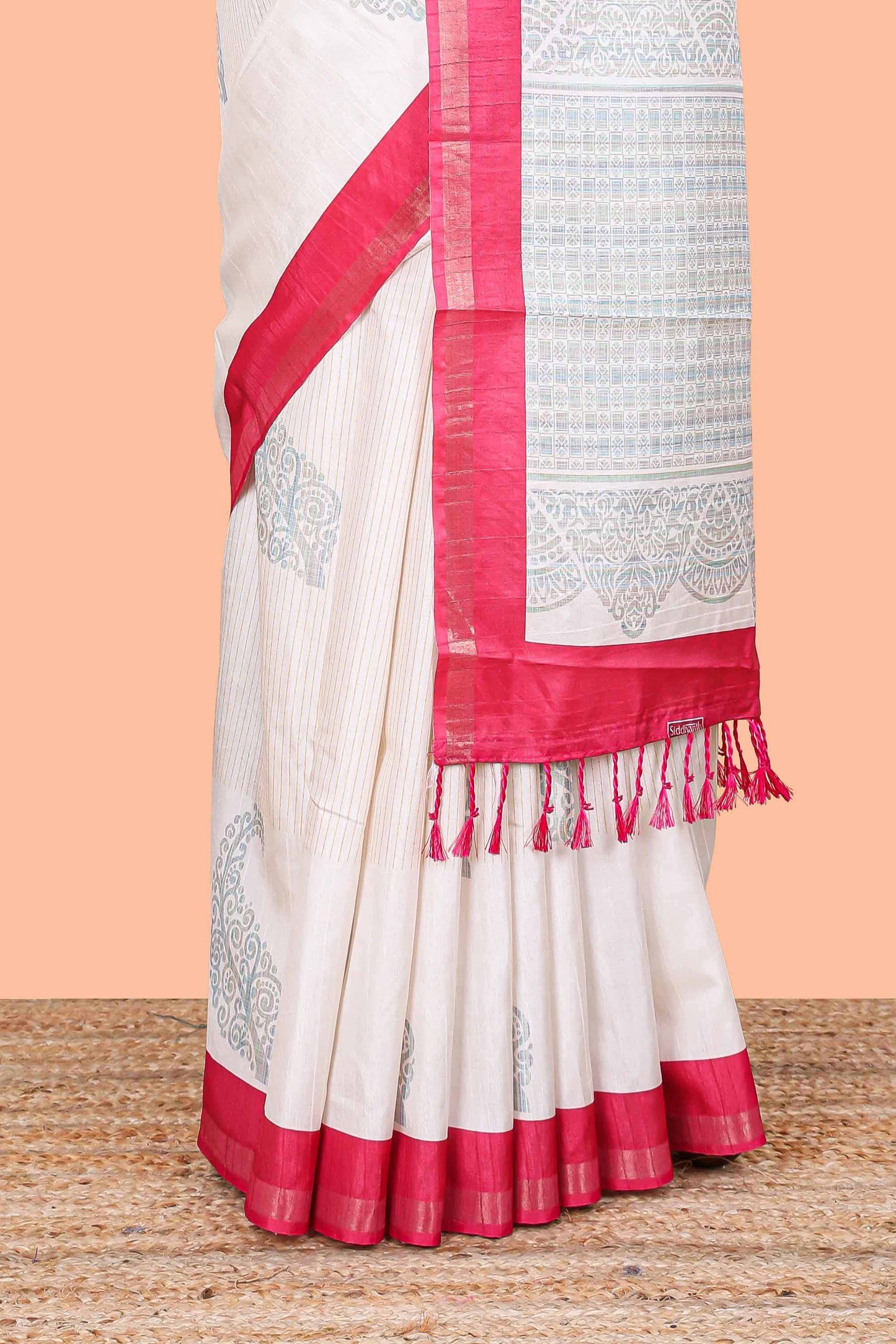 White striped floral butta art tussar saree with contrast zari border and matching pallu