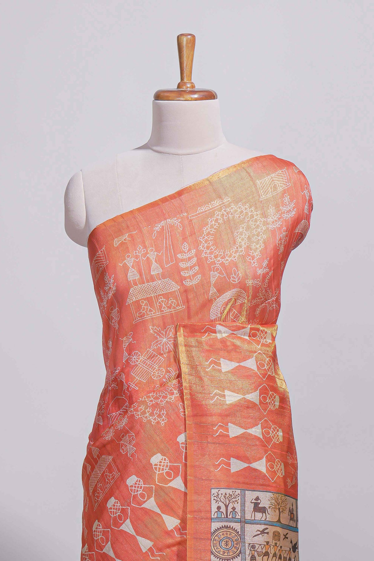 Orange warli printed semi tussar saree with contrast warli printed pallu and matching blouse