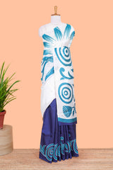 White and navy blue floral print litchi art silk saree with scallop print pallu