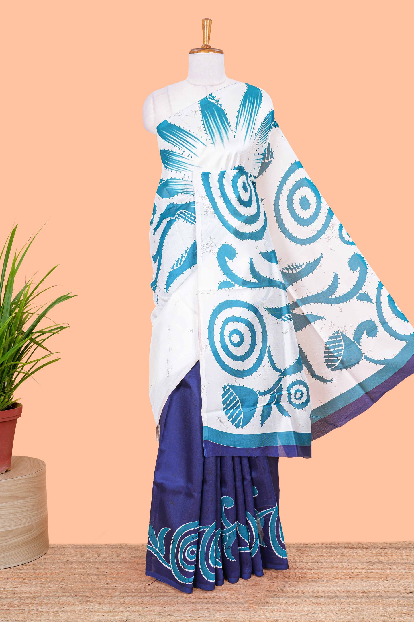 White and navy blue floral print litchi art silk saree with scallop print pallu