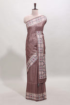 Tussar Silk Saree with a textured mauve body geometric woven border and a designer pallu with tassel along with blouse