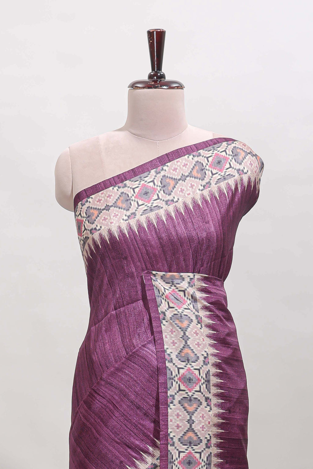 Tussar Silk Saree with a textured violet body geometric woven border and a designer pallu with tassel along with blouse