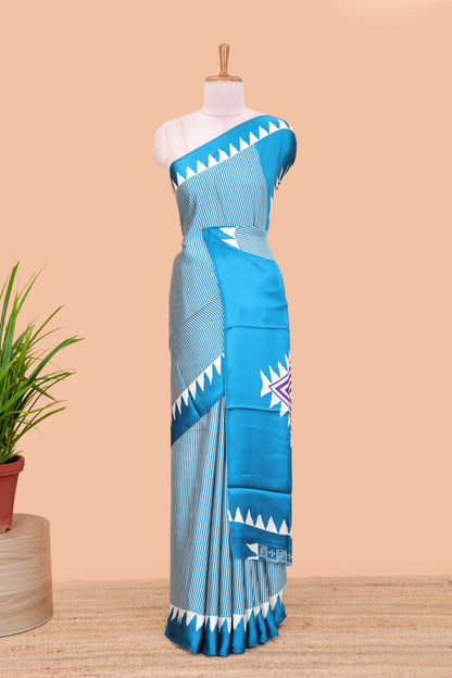 Blue satin ajrakh modal printed saree with striped body and geometric print border and pallu