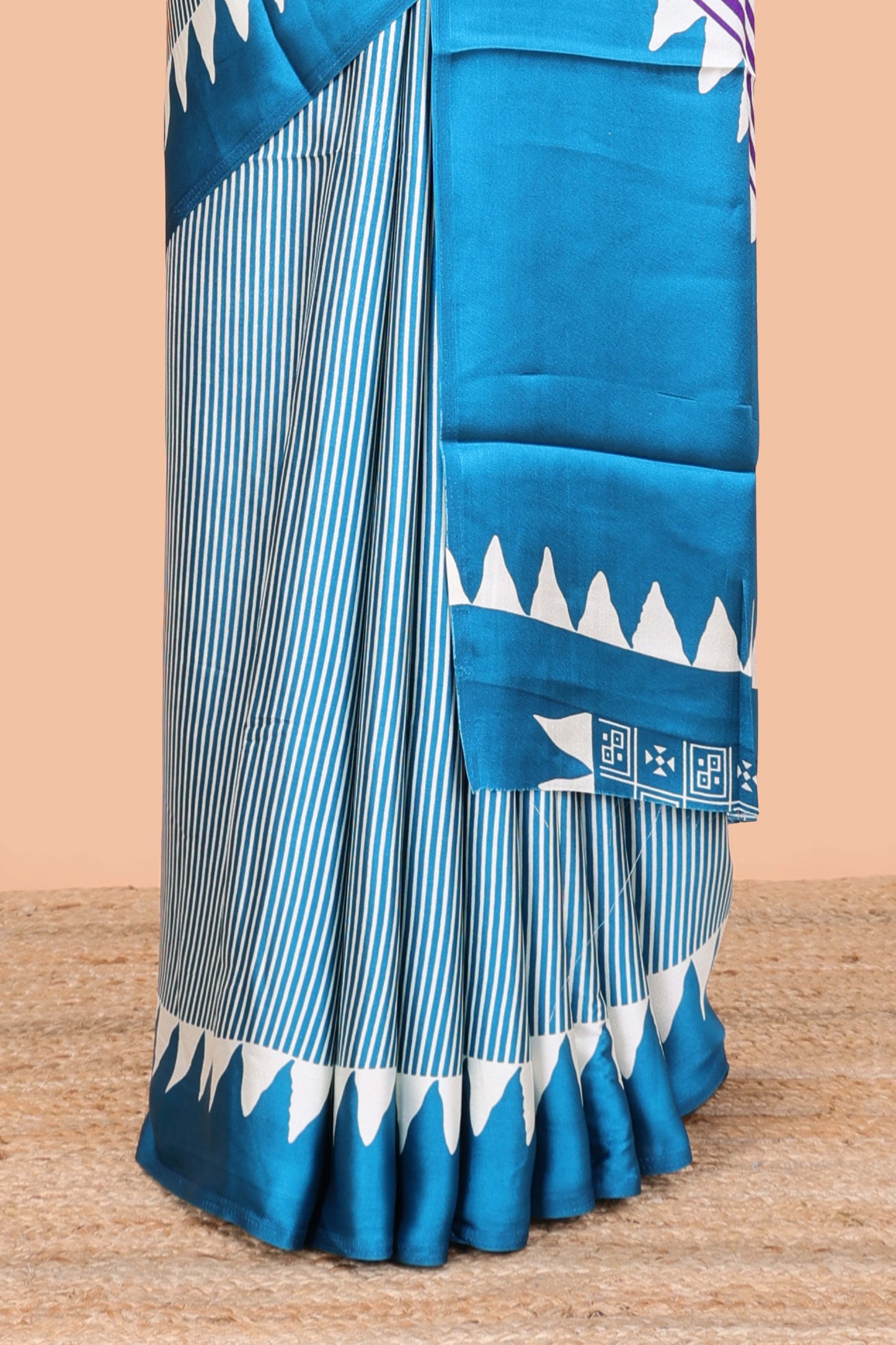Blue satin ajrakh modal printed saree with striped body and geometric print border and pallu