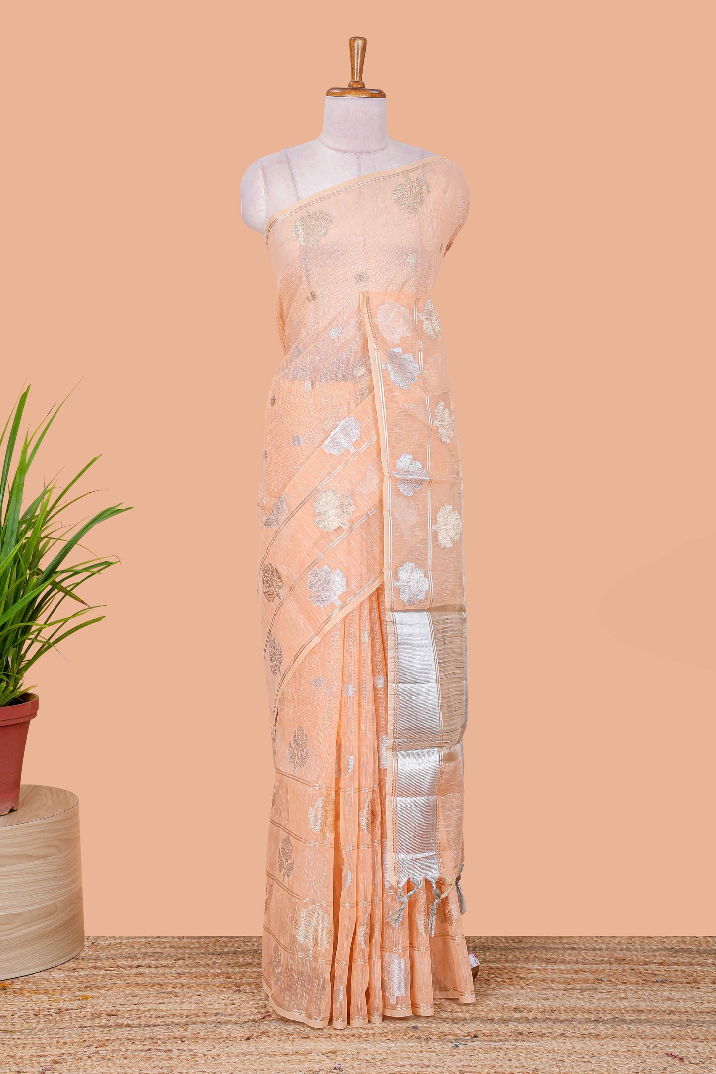 Orange floral zari butta linen tissue saree with zari border and contrast blouse
