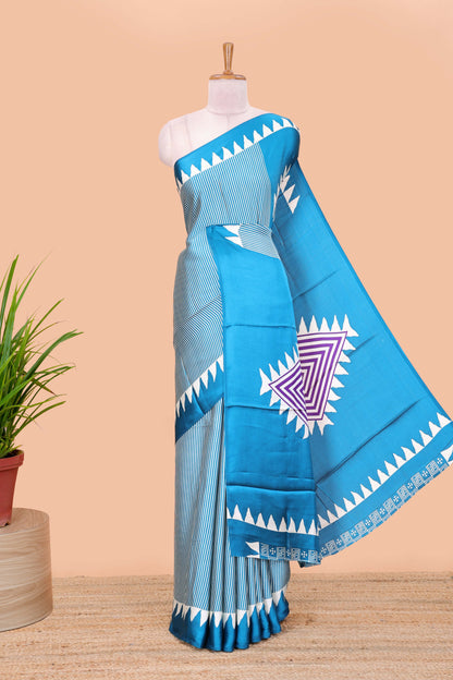 Blue satin ajrakh modal printed saree with striped body and geometric print border and pallu