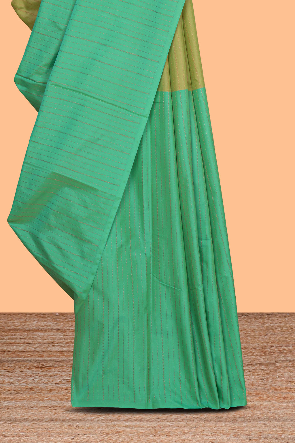 Borderless green dual tone striped design arani gift saree with self pallu and matching blouse