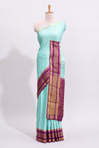 Blue zari butta art mysore silk saree with contrast zari border and motifs blouse