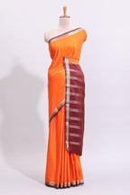 Orange plain art mysore silk saree with contrast zari border and blouse