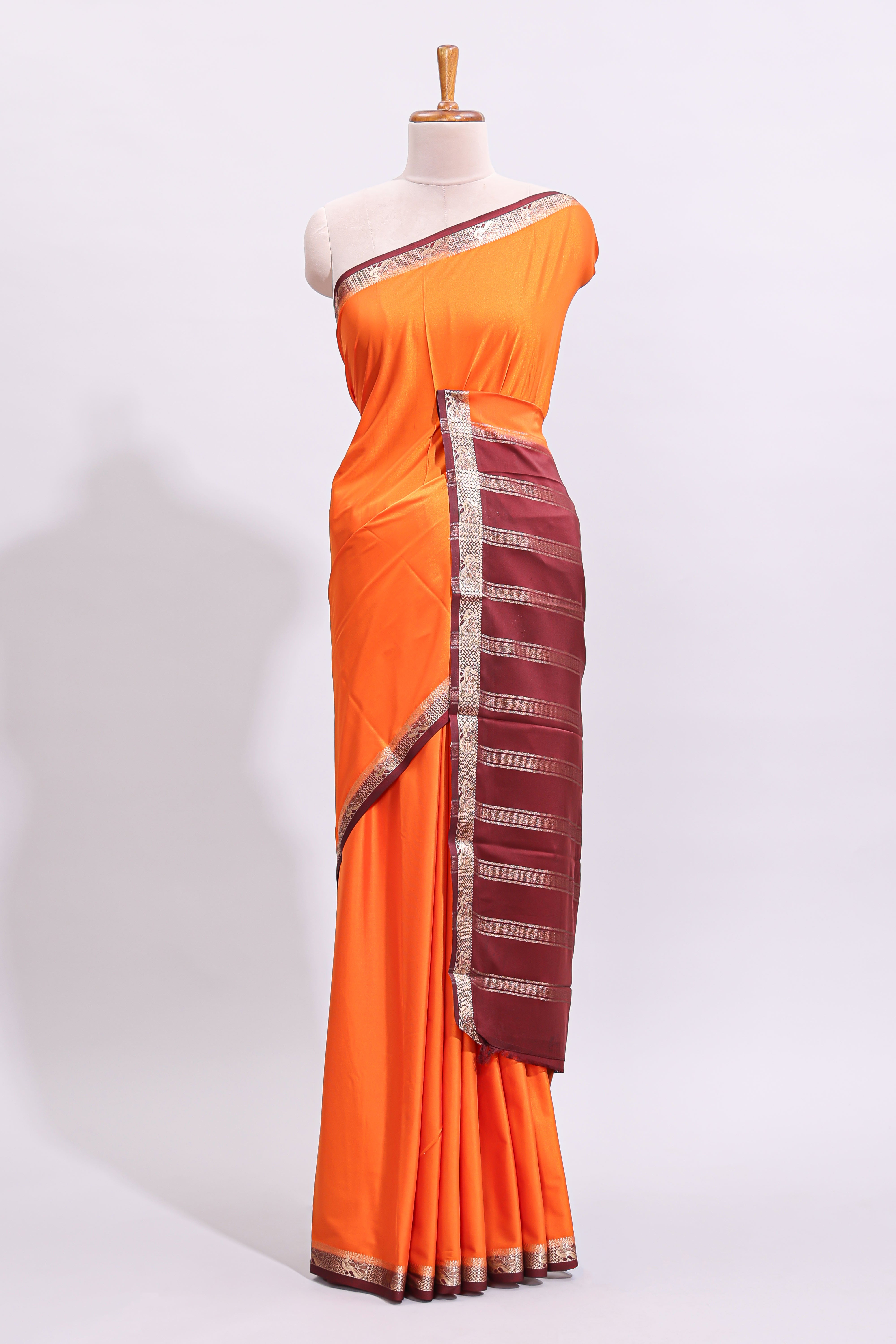 Orange plain art mysore silk saree with contrast zari border and blouse