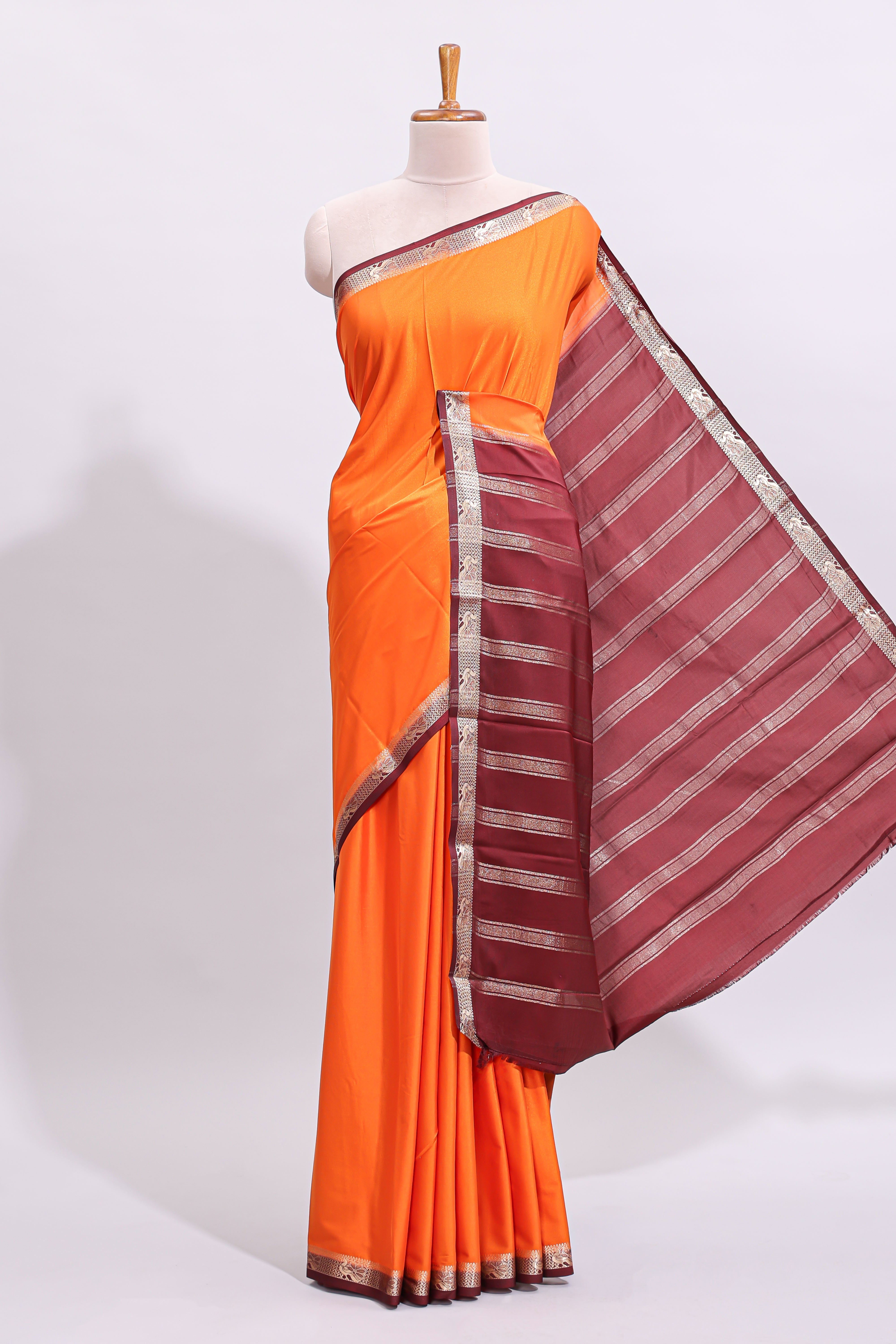 Orange plain art mysore silk saree with contrast zari border and blouse