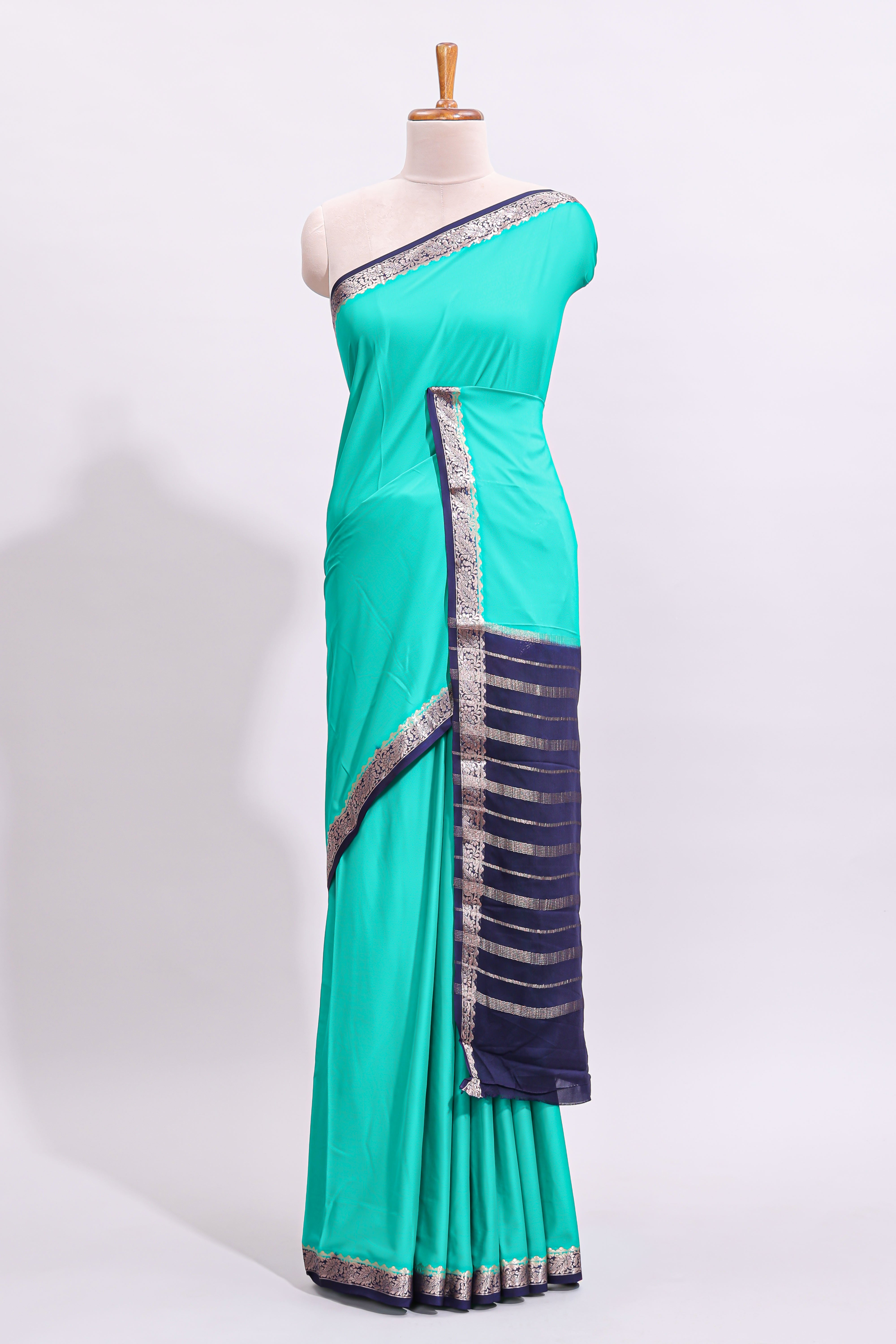 Green plain art mysore silk saree with contrast zari border and blouse