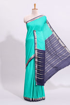 Green plain art mysore silk saree with contrast zari border and blouse