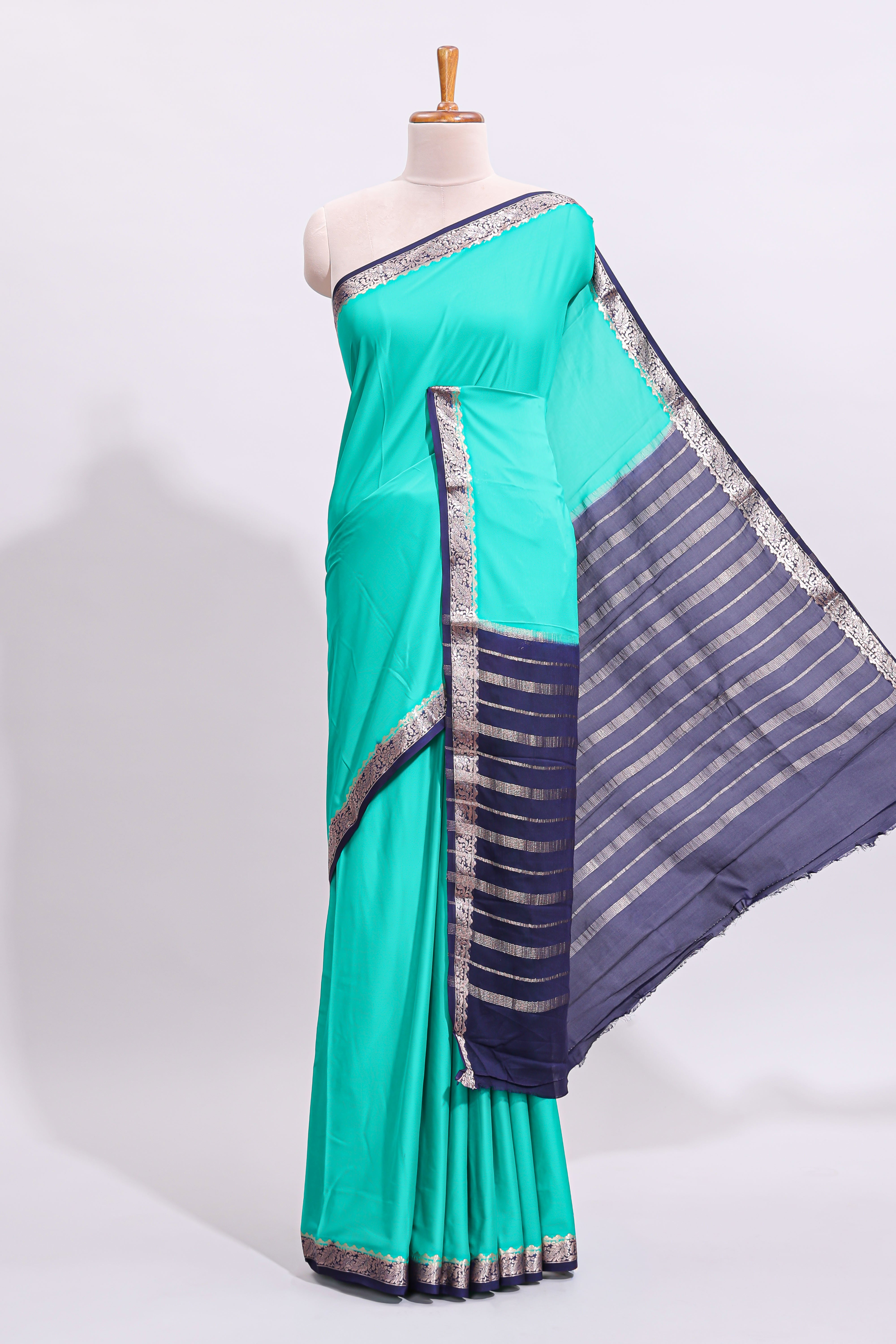 Green plain art mysore silk saree with contrast zari border and blouse