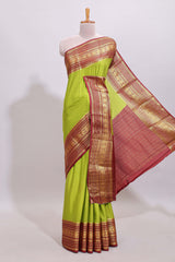 Green plain art mysore silk saree with contrast zari border and plain blouse