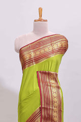 Green plain art mysore silk saree with contrast zari border and plain blouse