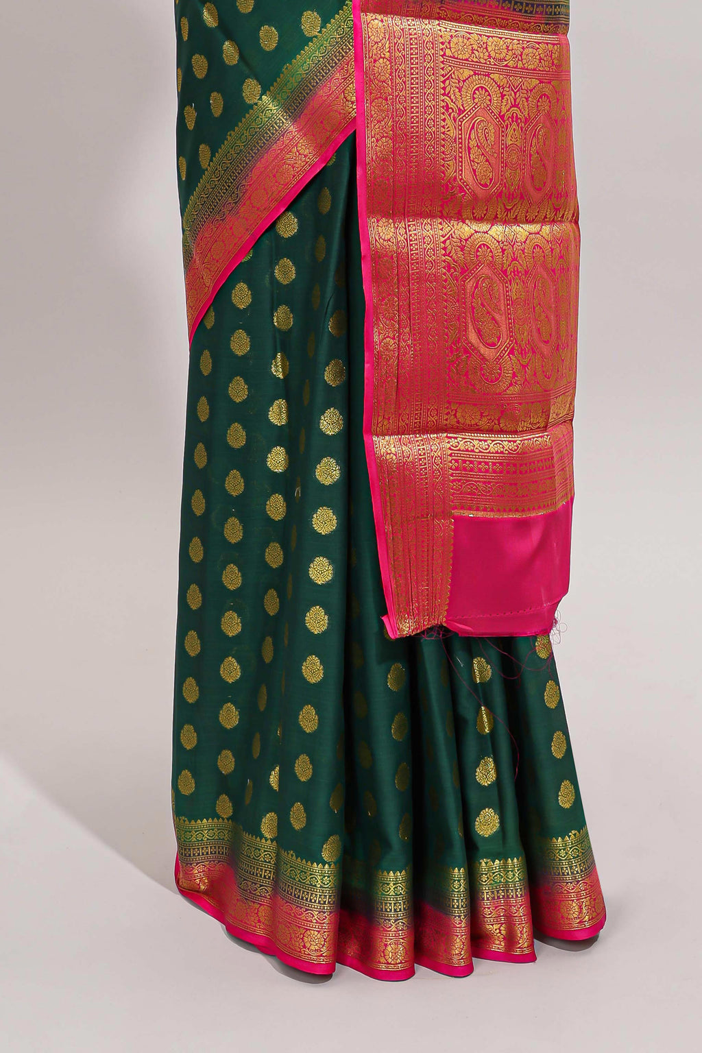 Dark green butta designed art mysore silk saree with contrast zari border and blouse