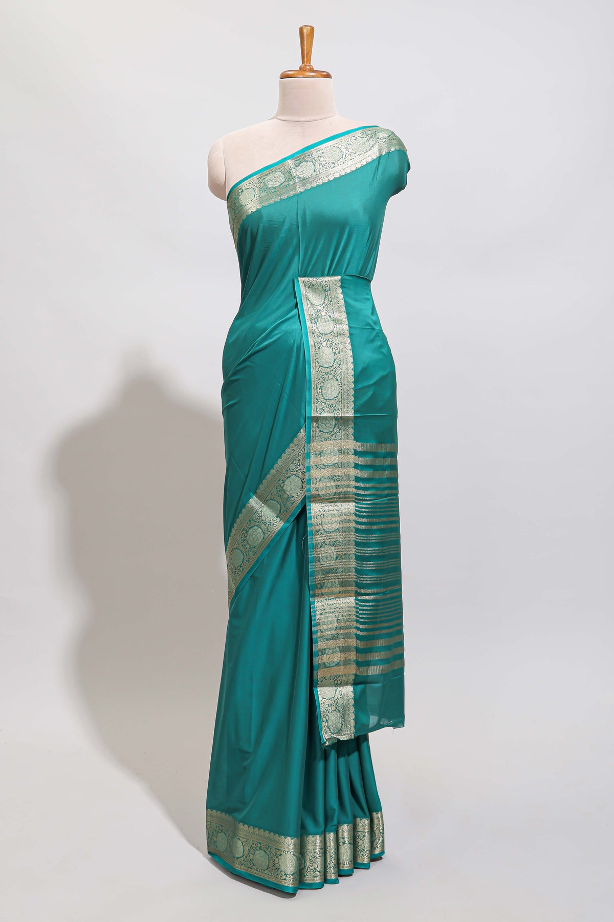 Green plain art mysore silk saree with self zari border and matching blouse
