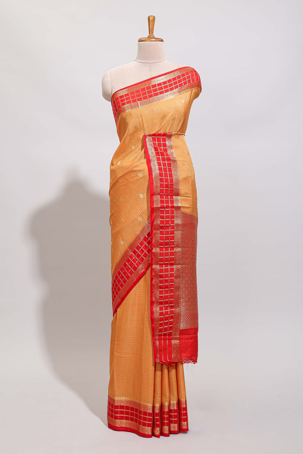 Orange checked zari motifs art mysore silk saree with contrast zari border and checked blouse
