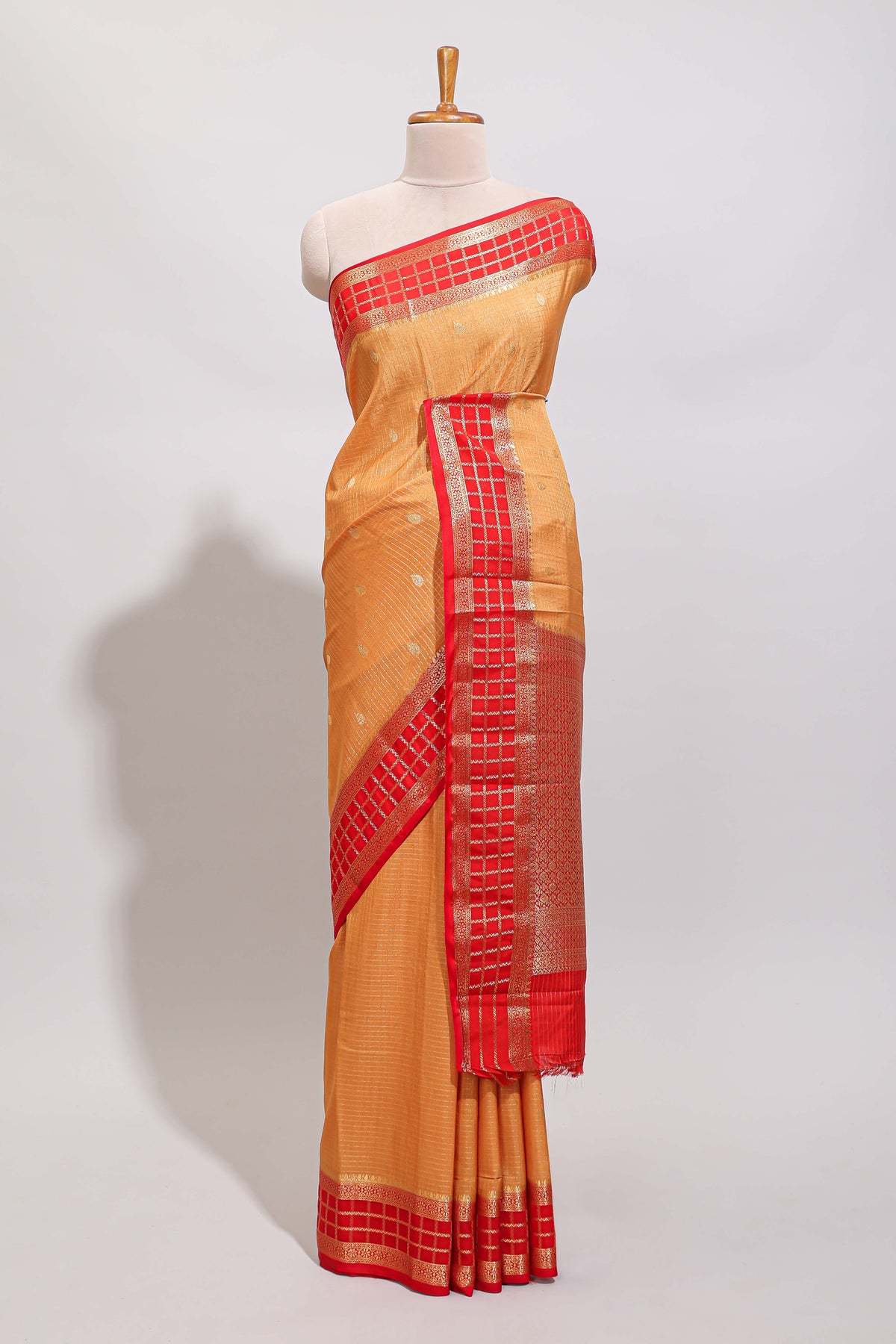 Orange checked zari motifs art mysore silk saree with contrast zari border and checked blouse