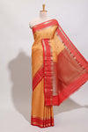 Orange checked zari motifs art mysore silk saree with contrast zari border and checked blouse