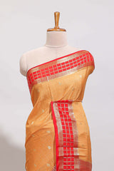 Orange checked zari motifs art mysore silk saree with contrast zari border and checked blouse
