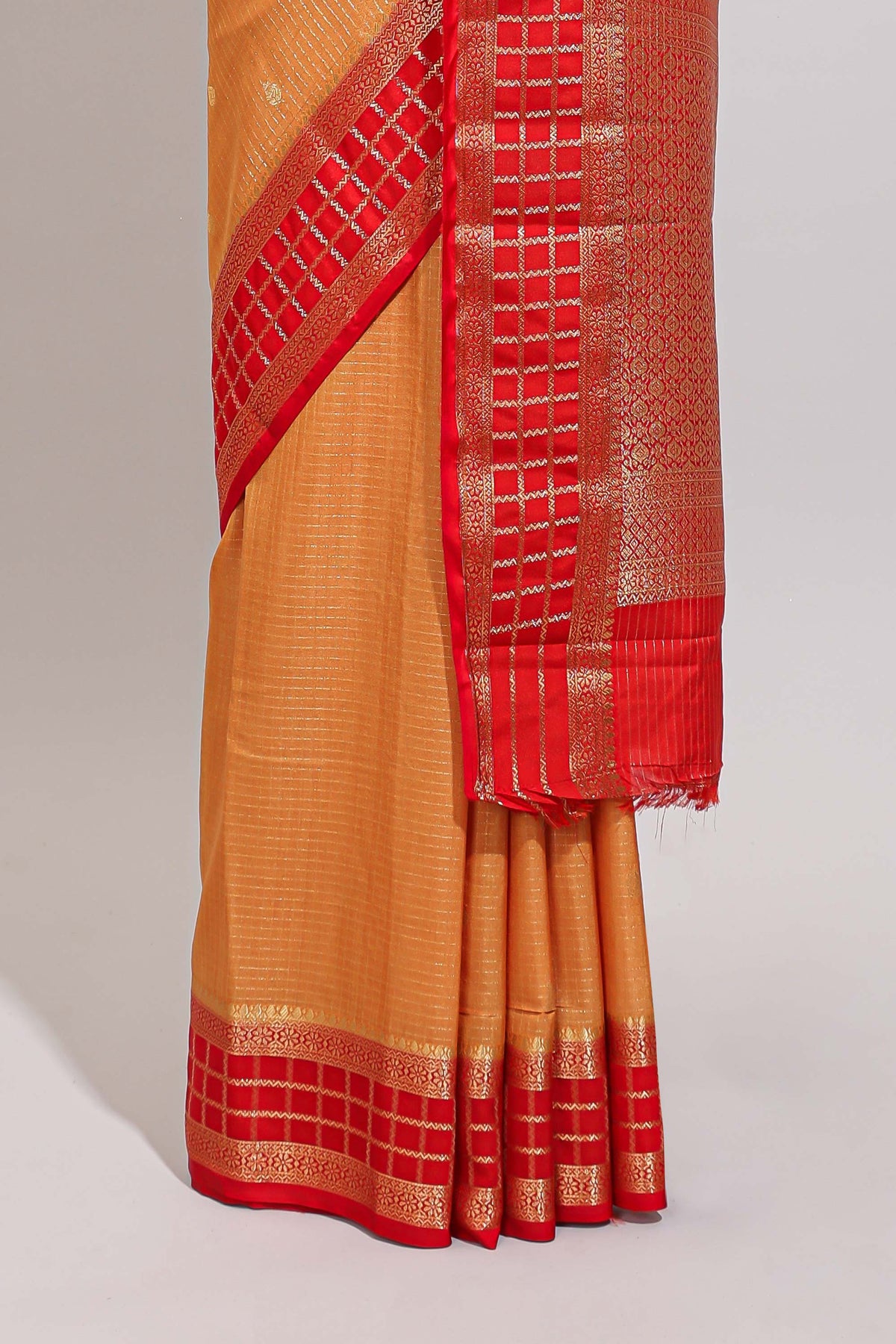 Orange checked zari motifs art mysore silk saree with contrast zari border and checked blouse
