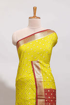 Lemon yellow checked zari motifs art mysore silk saree with contrast zari border and checked blouse