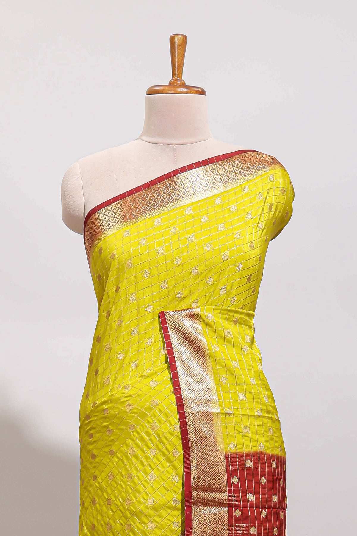 Lemon yellow checked zari motifs art mysore silk saree with contrast zari border and checked blouse