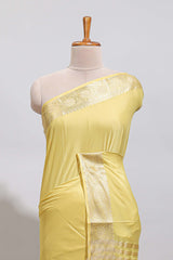 Pale yellow plain design art mysore silk saree with self zari border and matching blouse