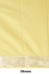 Pale yellow plain design art mysore silk saree with self zari border and matching blouse