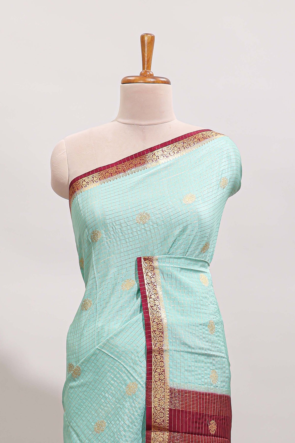 Turquoise green checked zari motifs design art mysore silk saree with contrast zari border and checked blouse