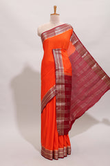 Orange plain design art mysore silk saree with contrast zari border and blouse