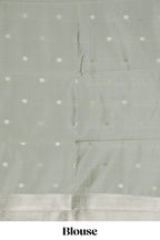 Pale green checked zari motifs art silk saree with self zari border and matching zari motifs blouse